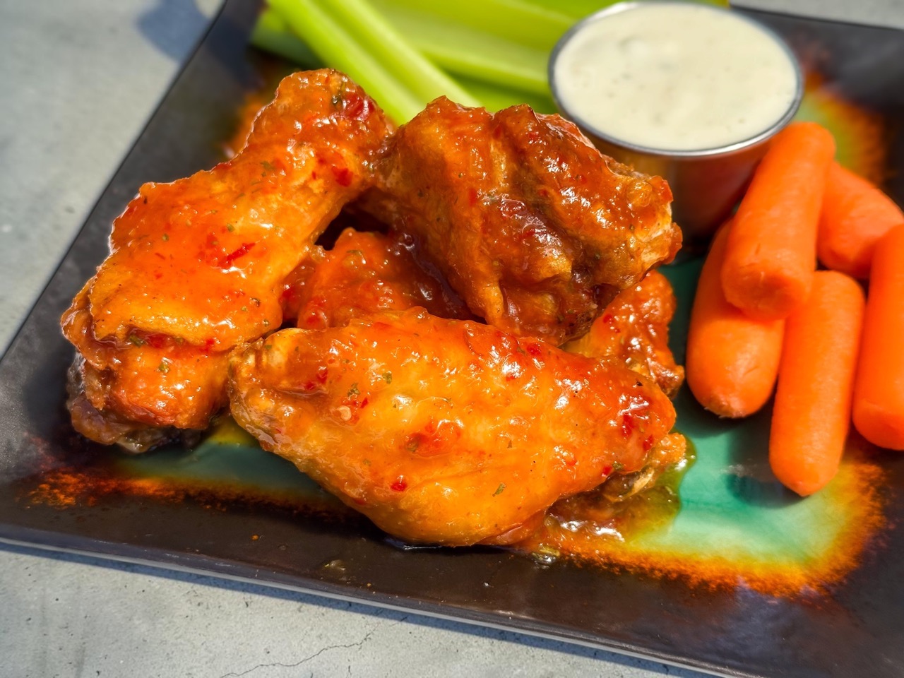 Chili Tailgate Tang wings — Flavor of the Week at The Dirty Buffalo