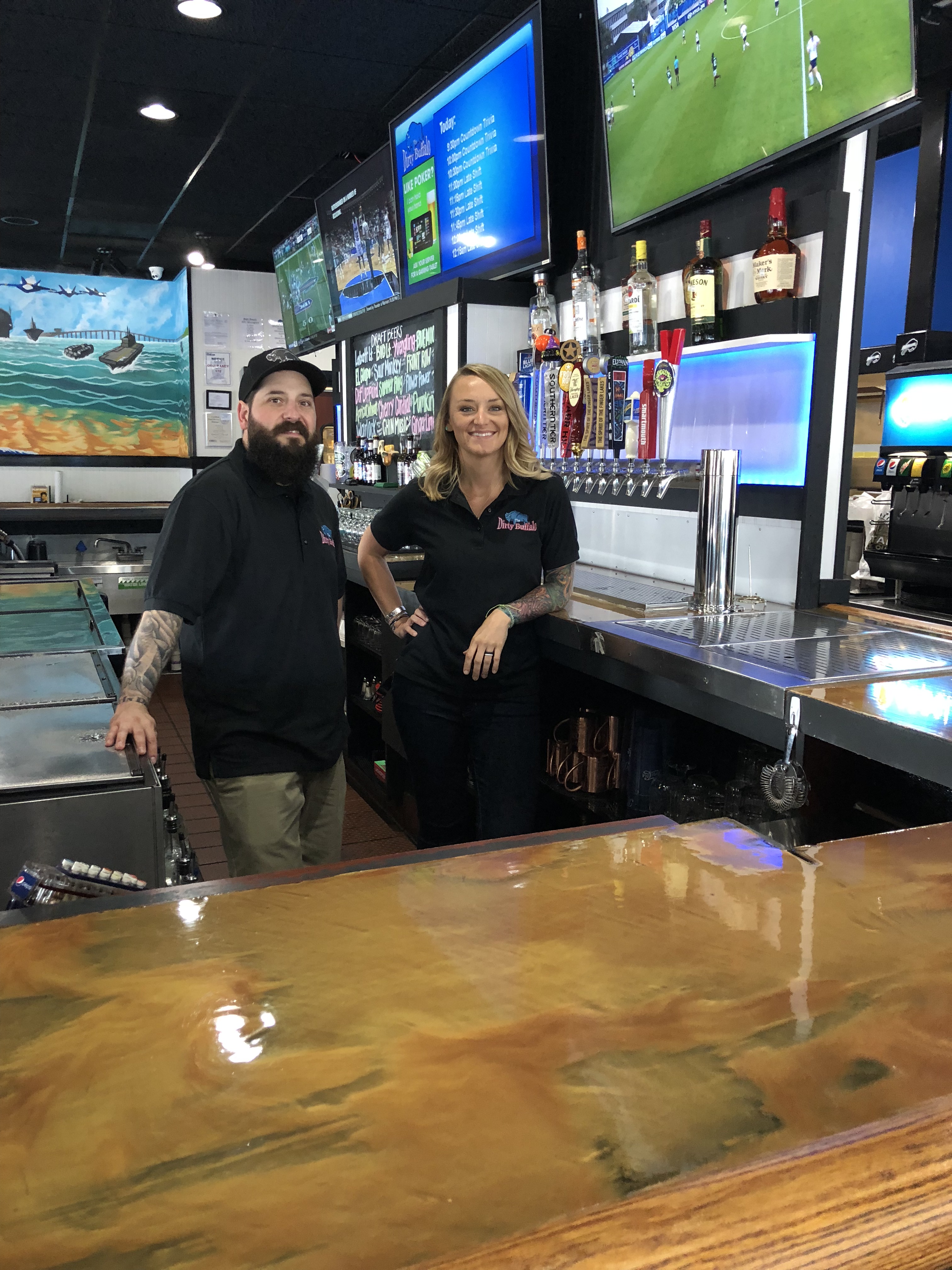 Two Dirty Buffalo managers behind the bar at Little Creek / East Beach