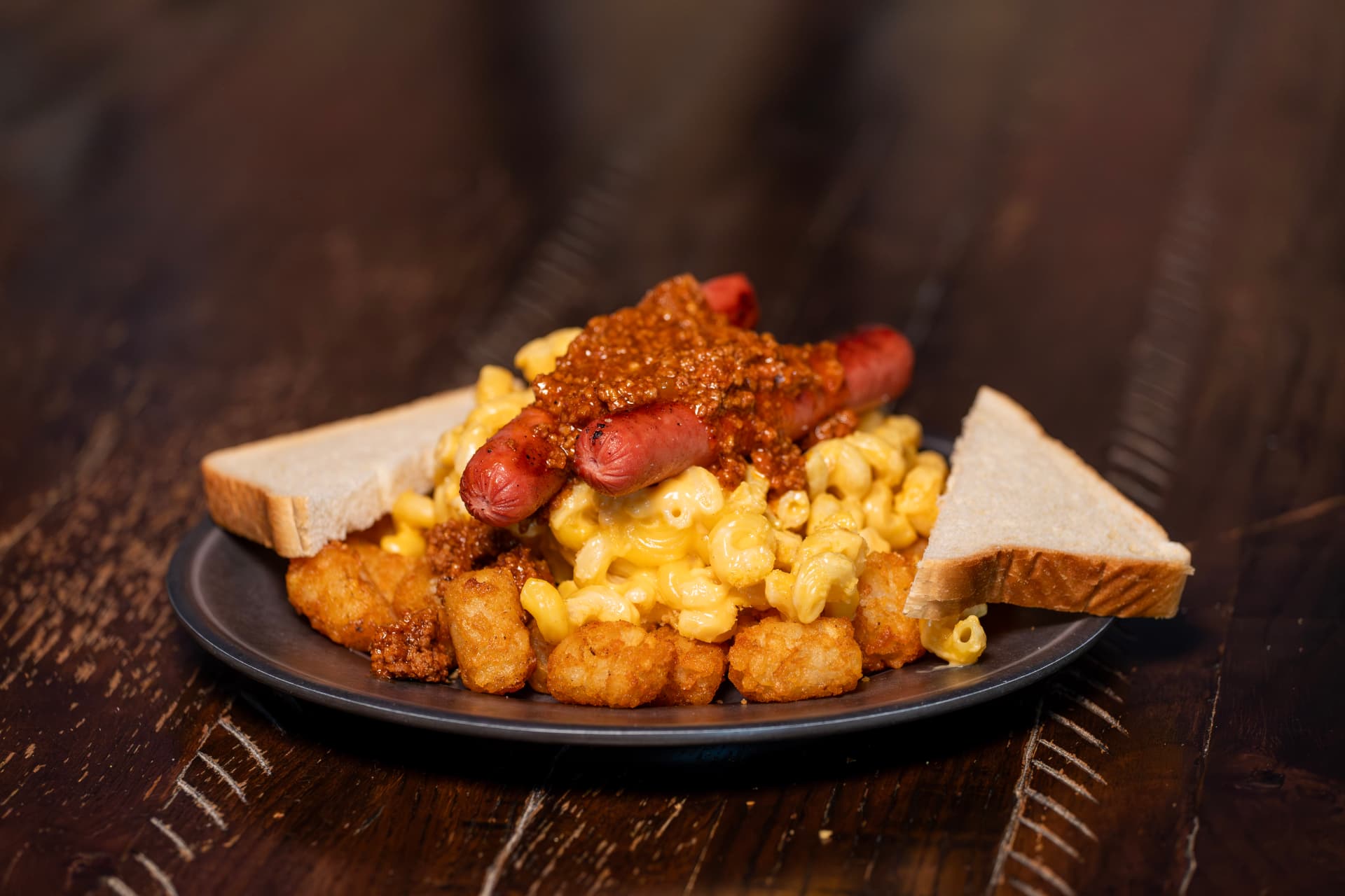 Create your own plate with hot dogs, mac-n-cheese, tater tots and Dirty Sauce
