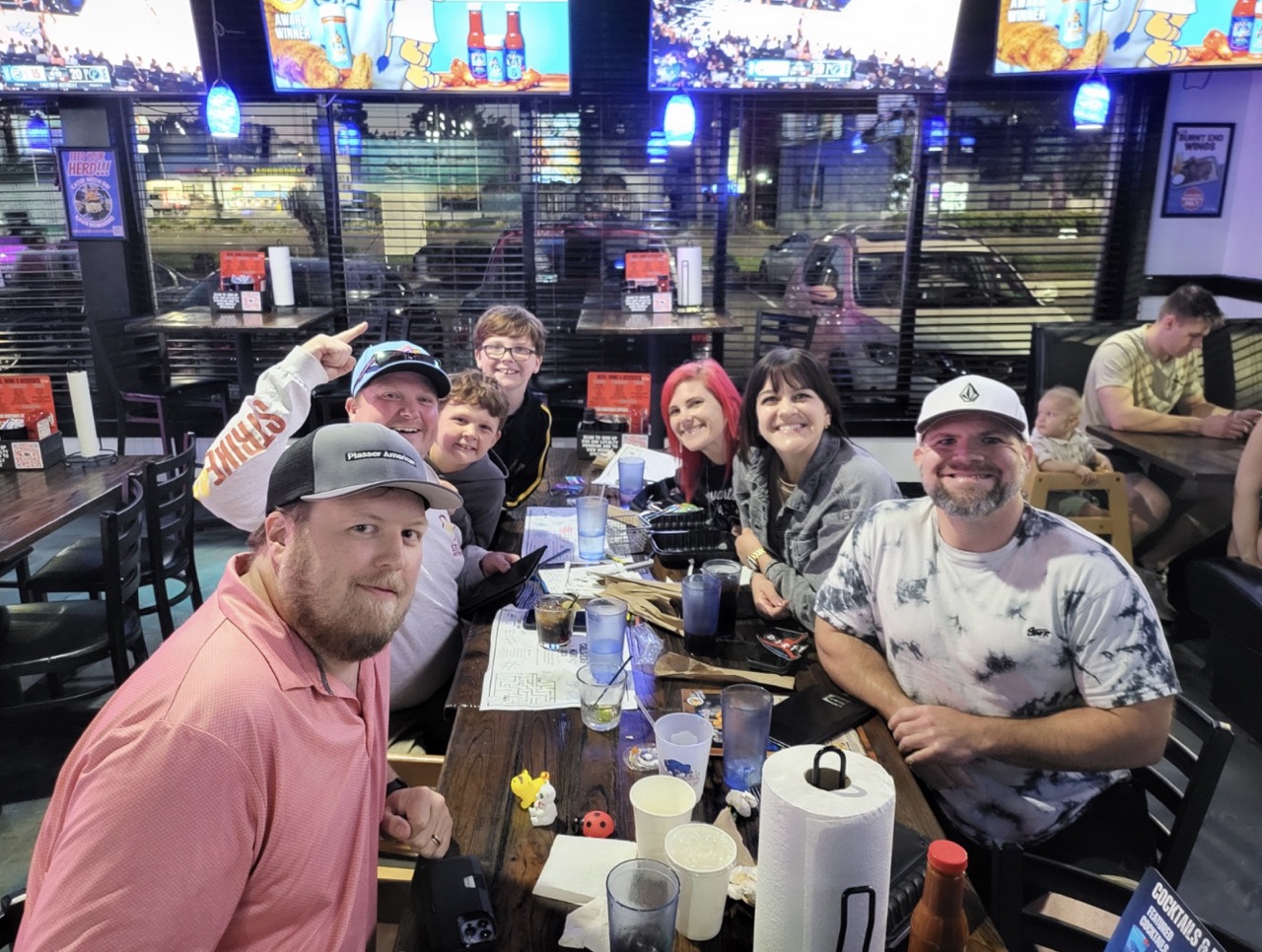 A group of friends and kids playing games together at The Dirty Buffalo