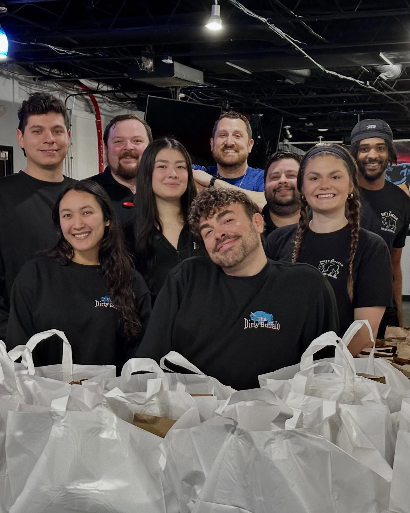 Colley Avenue team members packing catering bags together