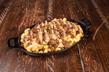 Southwest Philly Mac bowl with shaved sirloin, peppers and onions over mac-n-cheese