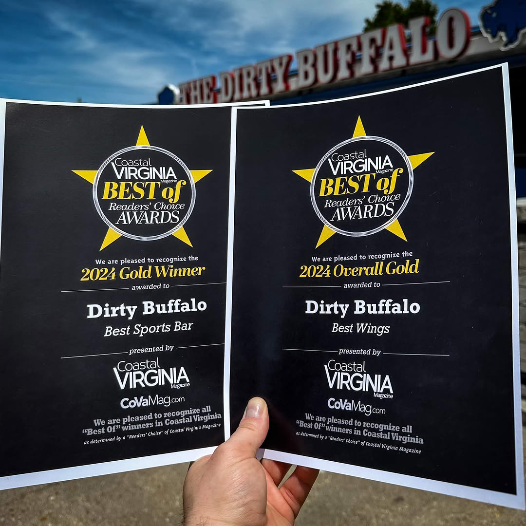 A Dirty Buffalo team member holding Coastal Virginia Best Of Readers Choice awards for Best Wings and Best Sports Bar