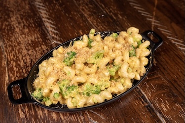 Broccoli Mac bowl with broccoli florets in mac-n-cheese topped with bread crumbs