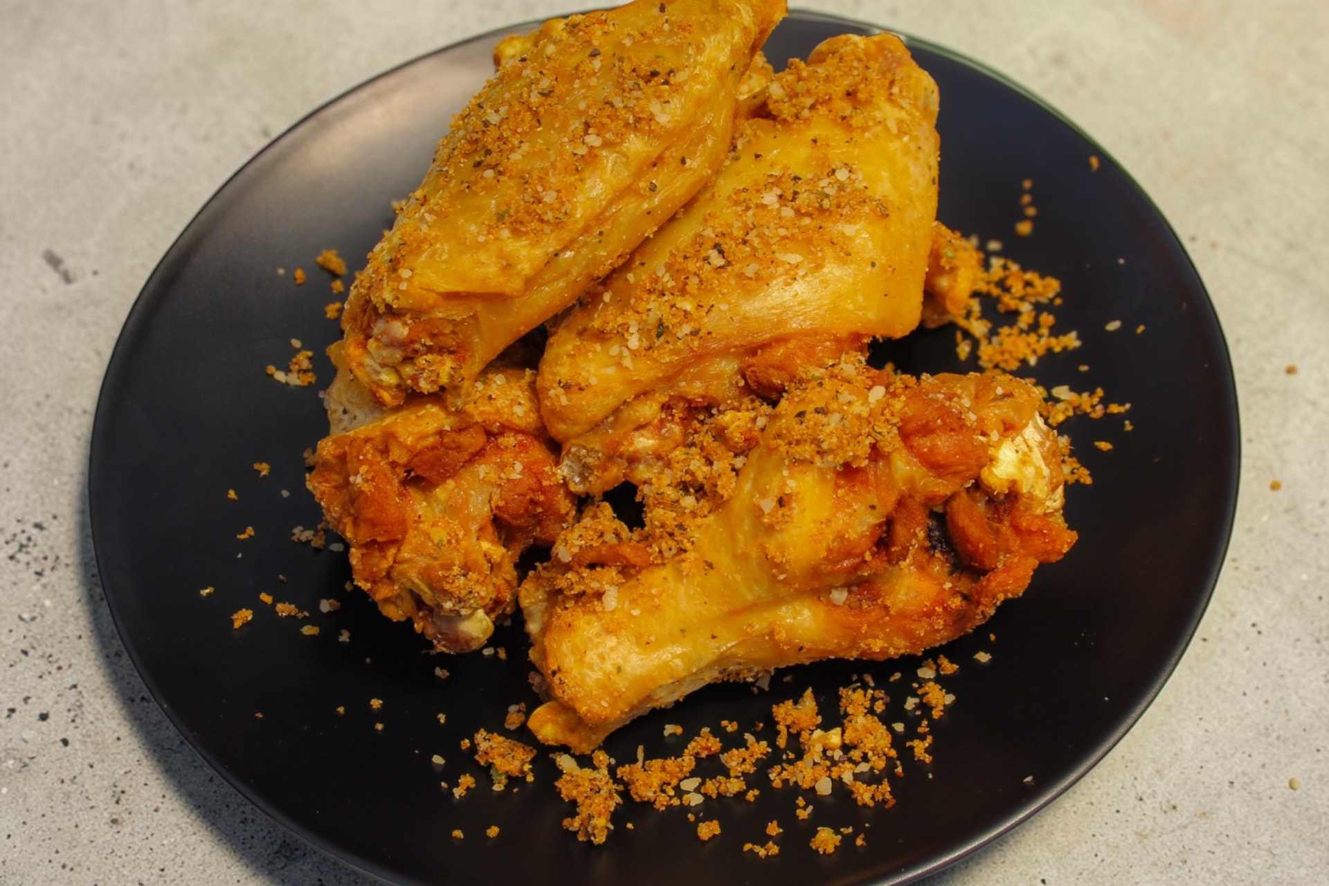 Wings tossed in a house dry rub at The Dirty Buffalo
