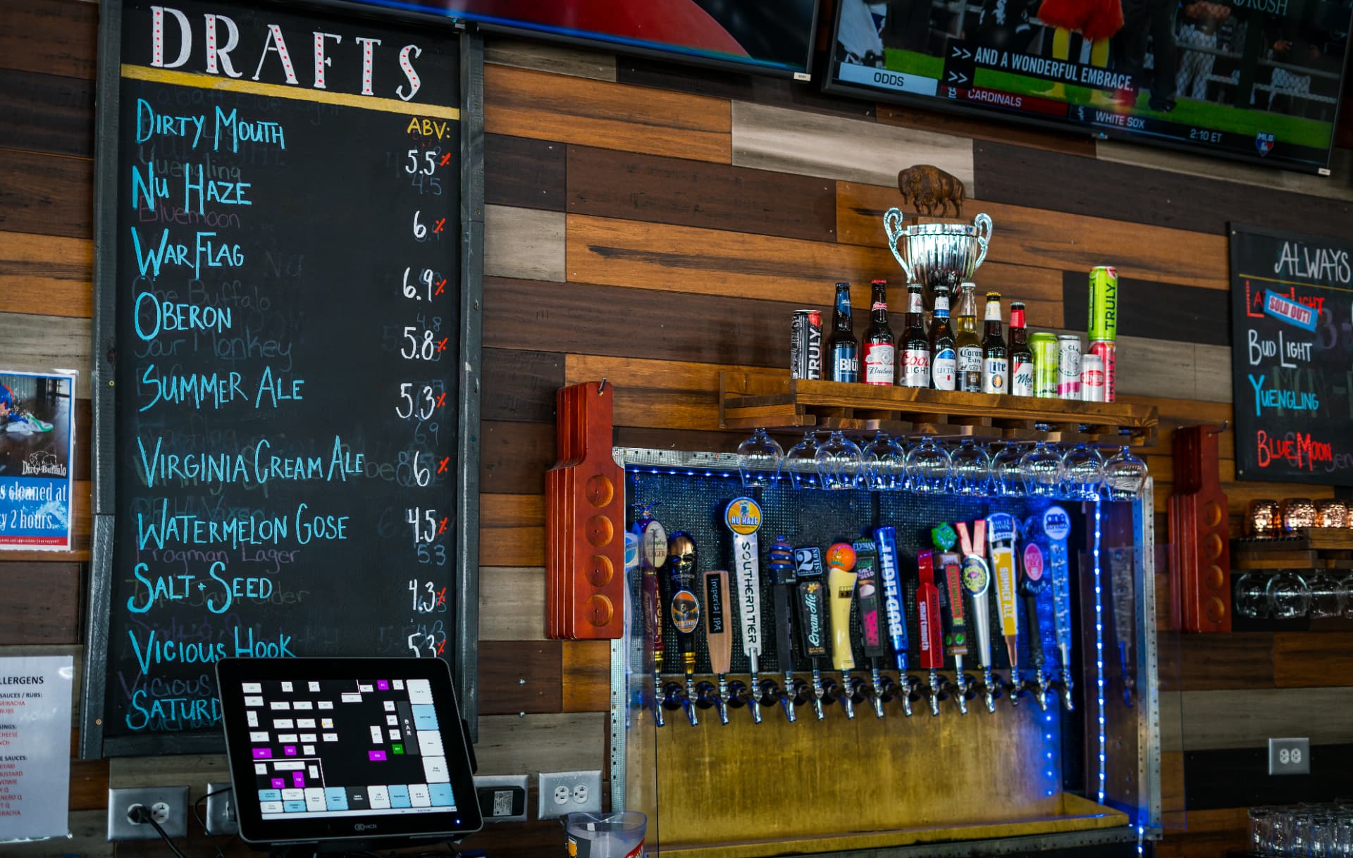 The chalkboard draft list above the taps at The Dirty Buffalo