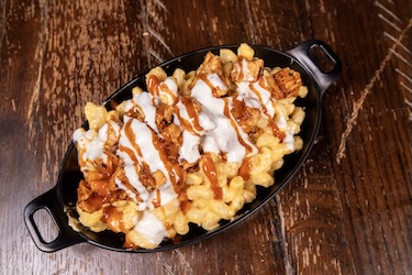 Cajun Chicken Mac bowl with grilled chicken, Cajun buffalo sauce and bleu cheese drizzle