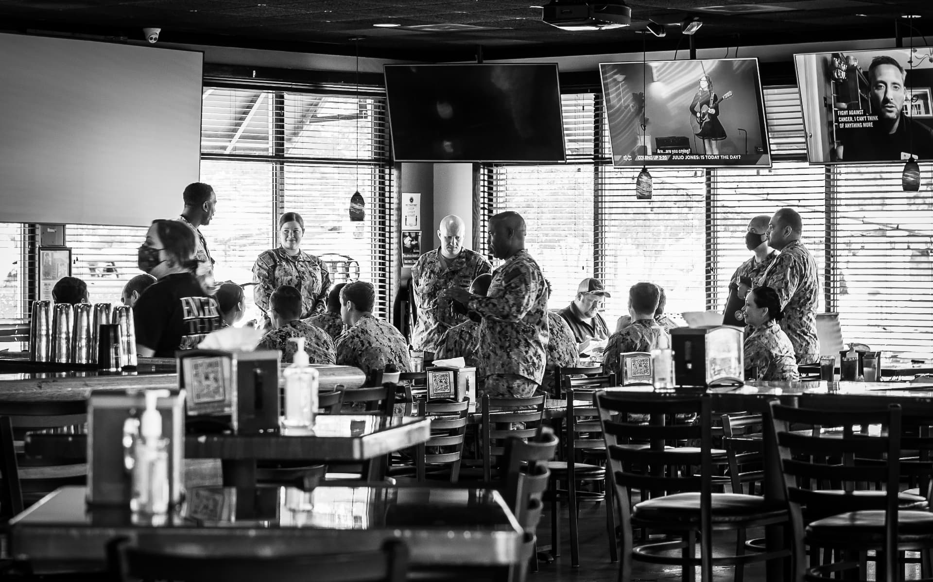 A group of service members eating together at The Dirty Buffalo